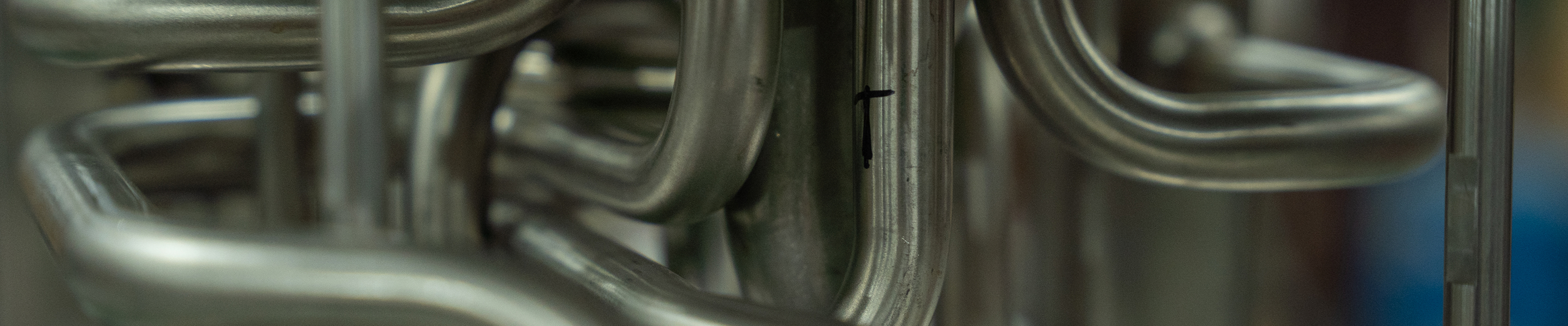 Industrial pipework used as a temporary Spunbond background.